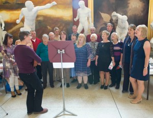 Members of The Leeside Serotones performing with Choral Leader Liz Powell at Crawford Art Gallery, October 2013 (pic. Ger McCarthy)